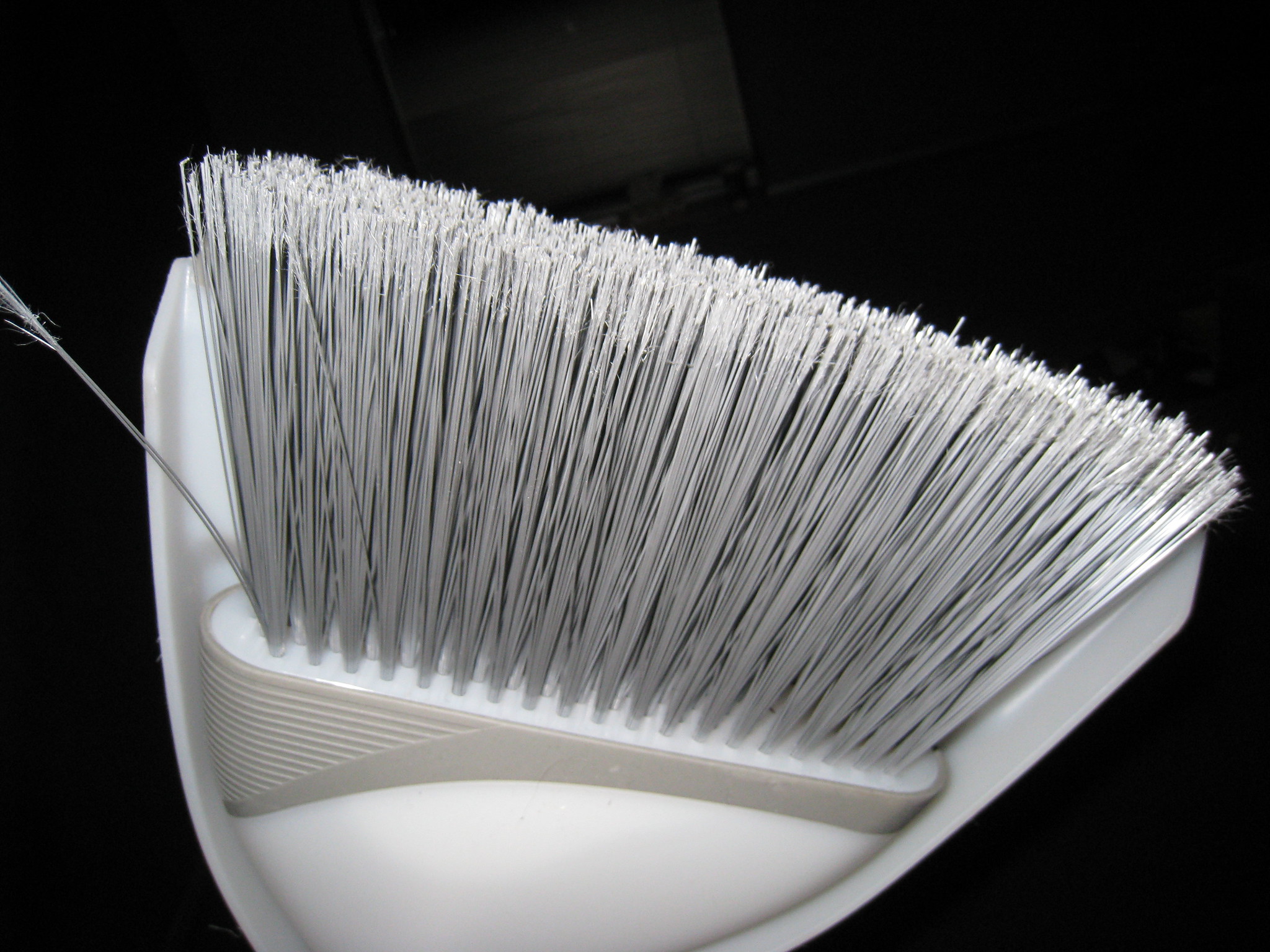 Clean your bathtub with a broom and dish soap to see soap scum disappear