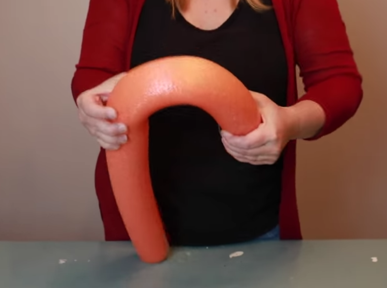 Mom uses pool noodles to create fantastic candy cane ornament for front