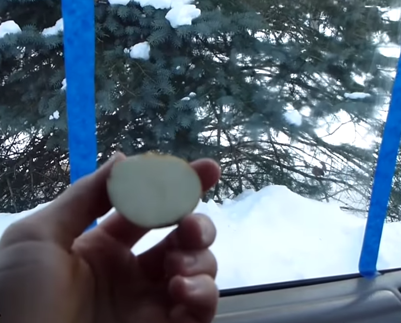 Man uses strips of painter’s tape to show how to easily defog car windows