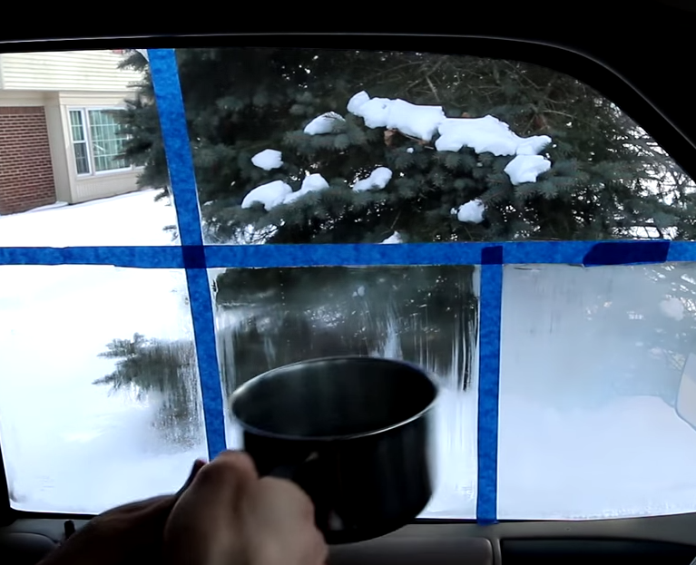 Man uses a piece of tape for the easiest way to defog windows for good