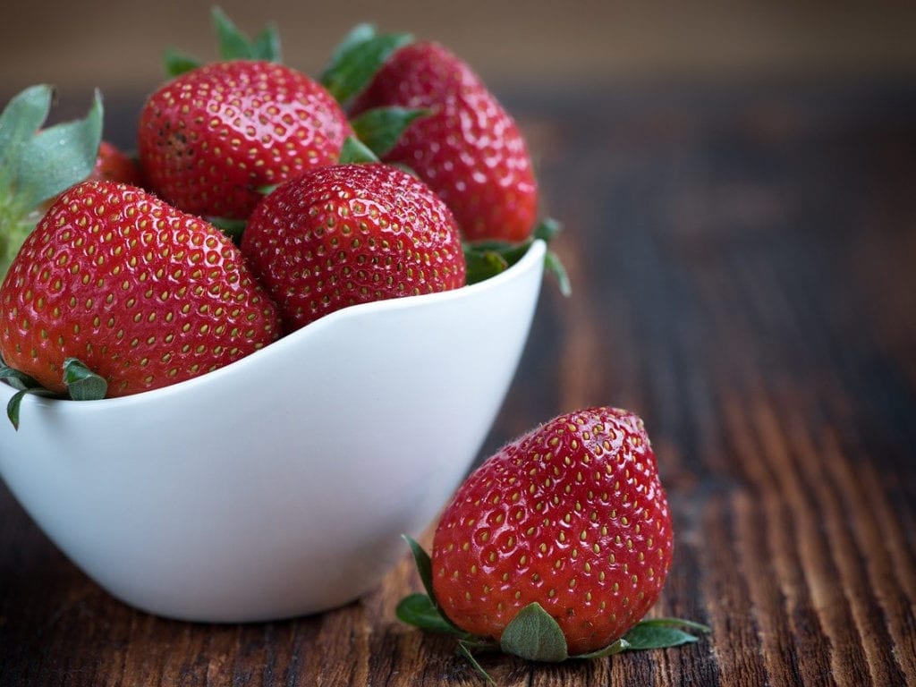 Grow strawberries at home using a laundry basket from the dollar store