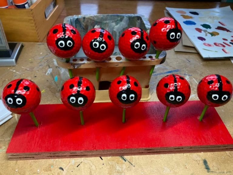 Upcycle old golf balls into adorable ladybugs for your garden