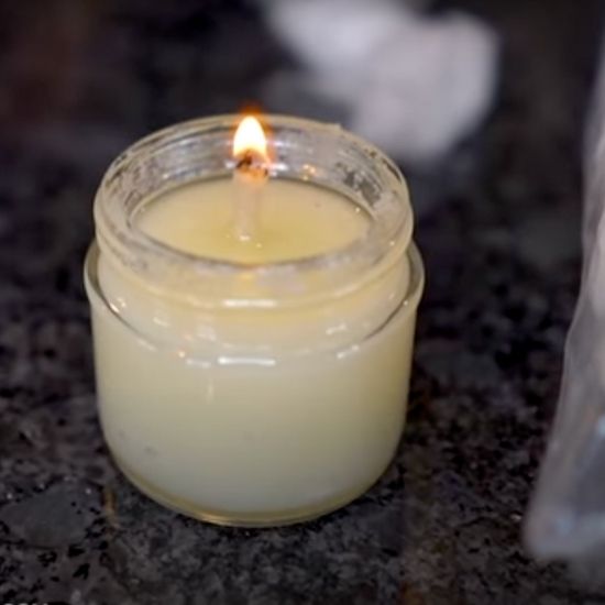 Woman makes candles from various kitchen items to see which one will