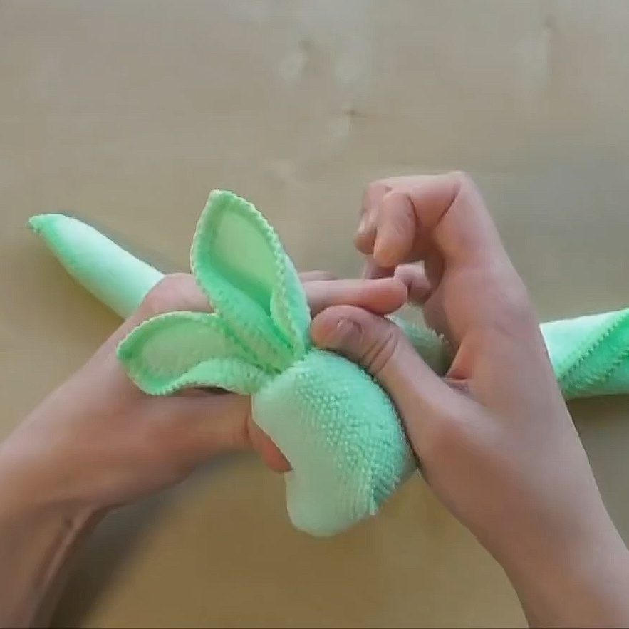 Use towels and rubber bands to make adorable little bunnies