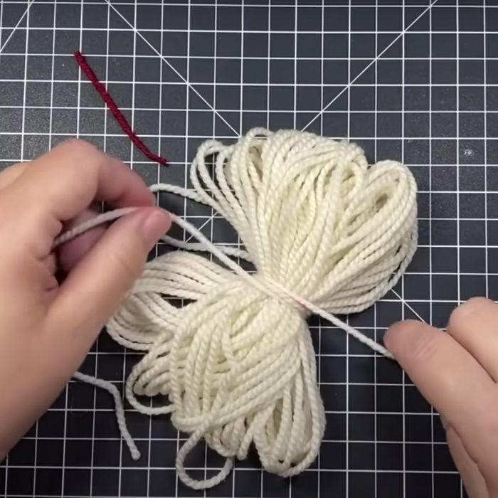 Make adorable gnome ornaments with yarn and cardboard