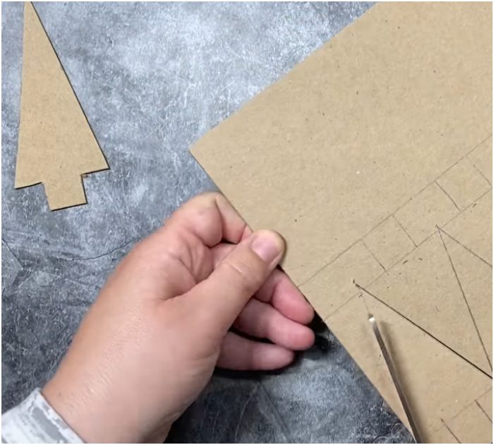 Gather yarn and twine to make these adorably rustic Christmas tree