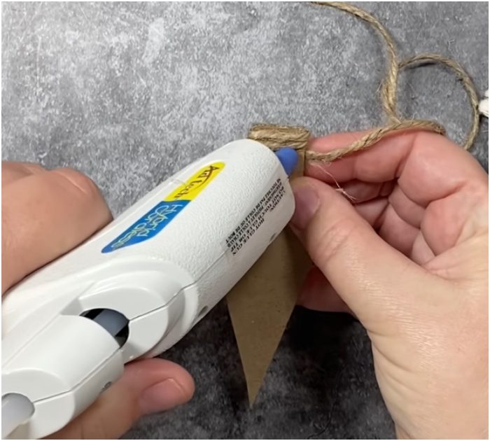 Gather yarn and twine to make these adorably rustic Christmas tree