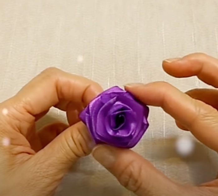Fold layers of ribbon over needle to make adorable ribbon roses