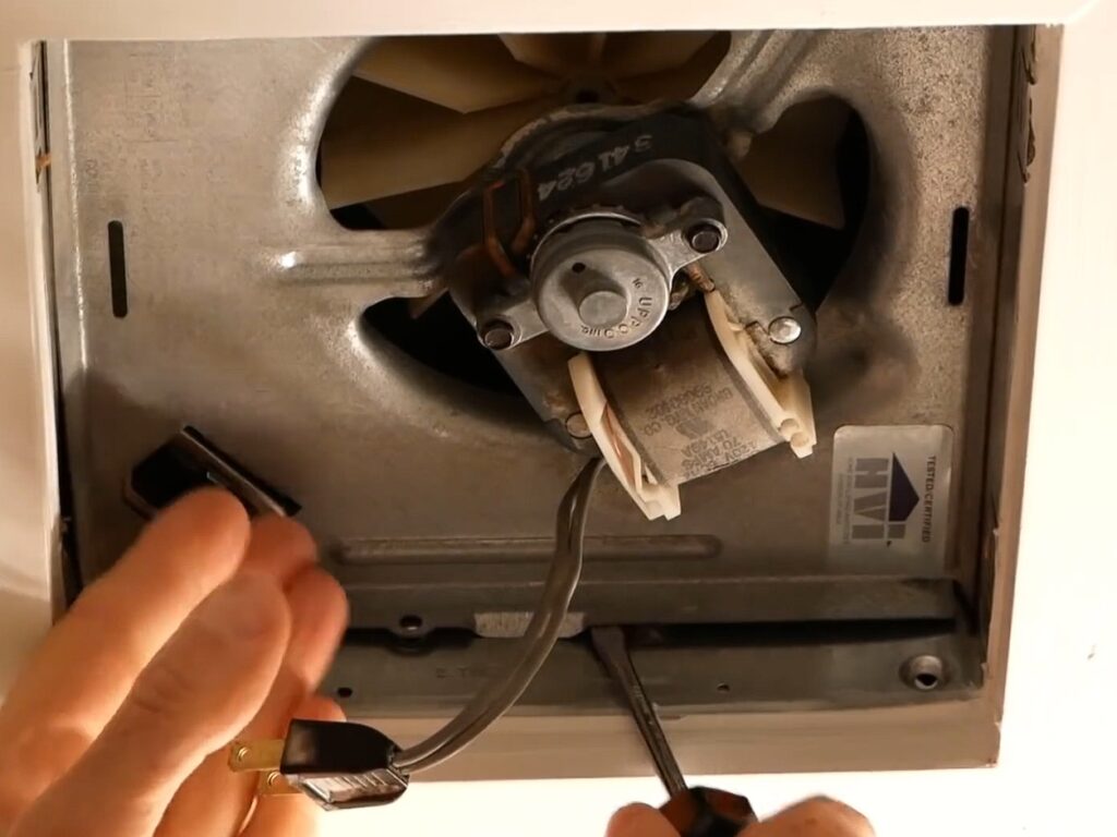 Home repairman shows how to replace bathroom fan in 5 minutes