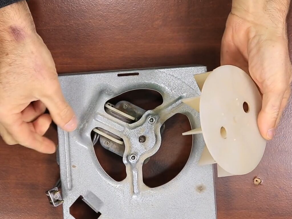 Home repairman shows how to replace bathroom fan in 5 minutes