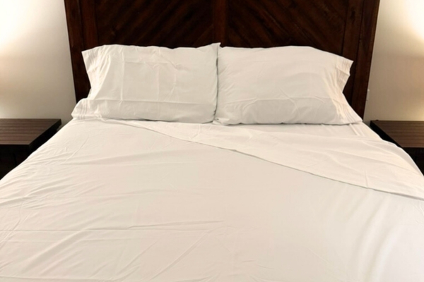 CGK Unlimited sheets on bed